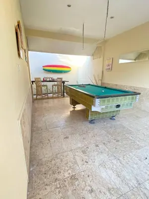 a room with a pool table and a frisbee at Sorry we close in Seminyak