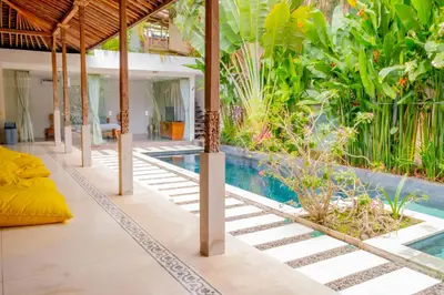 a pool in a house with a resort at Villa Marie Clare in Seminyak