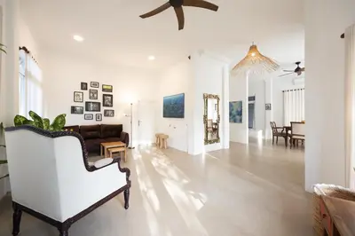 a living room with a piano and a couch at Villa Selamat, Seminyak, Batu Belig, 10 min from beach in Seminyak