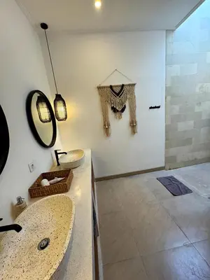 a bathroom with two sinks and a shower at Cosy 2bed/2bath villa 5 min to beach in Dalung