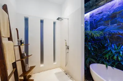 a bathroom with a bath tub and a sink at Villa Céline 1 Bdr pool Seminyak in Seminyak