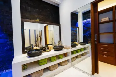a bathroom with two sinks and a mirror at Villa Céline 1 Bdr pool Seminyak in Seminyak