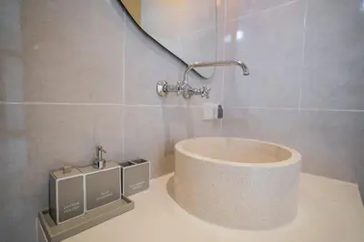 a bathroom with a sink with a faucet at NEW! Villa Sony 2 - 3BR villa next to Legian Beach in Seminyak