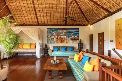 a living room with a couch and a table at Rose 2BR Private Pool Villa in Kerobokan