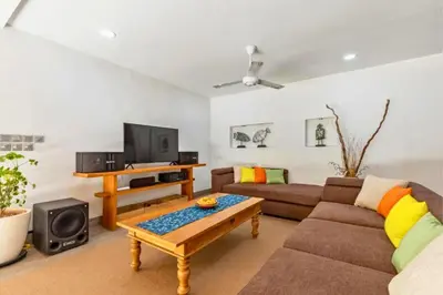 a living room with a couch and a coffee table at Rose 2BR Private Pool Villa in Kerobokan