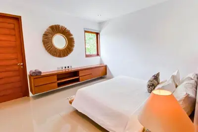 a bedroom with a bed and a mirror on the wall at Luxury 2 BR Private Pool Villa ZN101 in Seminyak