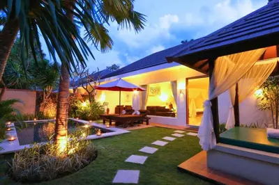 a backyard with a pool and a house at Lavender 1 BR Private Pool Villa in Seminyak