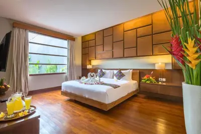 a bedroom with a large bed and a large window at Luxury 3 BR Private Pool Villa in Seminyak
