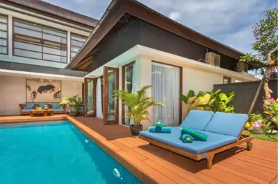 a villa with a swimming pool and a house at Luxury 3 BR Private Pool Villa in Seminyak