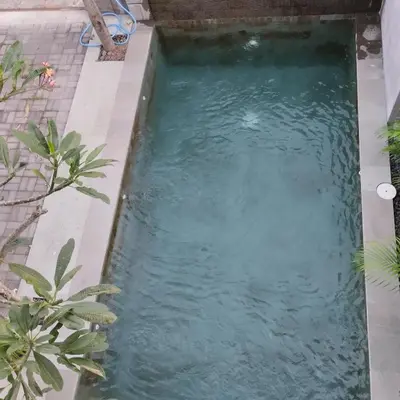 a small pool of water in a backyard at Jimbaran Beauteous Villa in Jimbaran