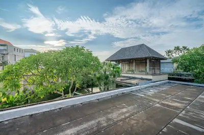 a view from the roof of a building with trees at Villa Ayuni, Berawa in Canggu