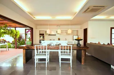 a kitchen and dining room with a table and chairs at Cozy 2 BR Private Pool Villa in Seminyak