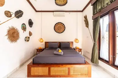 a bedroom with a bed in a room at Cosy Traditional and Fresh 2 BD Sunterrace Villa with Pvt Pool in Kerobokan