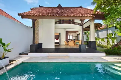 a swimming pool in front of a house with a gazebo at Entire 2 BR Private Pool Villa in Seminyak