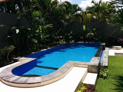 an image of a swimming pool in a garden at Villa Viona 4 in Seminyak