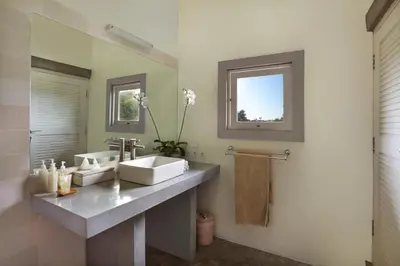 a bathroom with a sink and a mirror at Villa Viona 4 in Seminyak