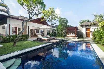 a swimming pool in the backyard of a villa at Ghana Villa Seminyak by GenuineHost in Seminyak