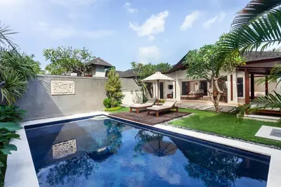 an image of a swimming pool in the backyard of a house at Ghana Villa Seminyak by GenuineHost in Seminyak