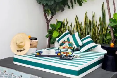 a table topped with blue and white pillows at Romantic 1BR Private Pool Villa in Kerobokan