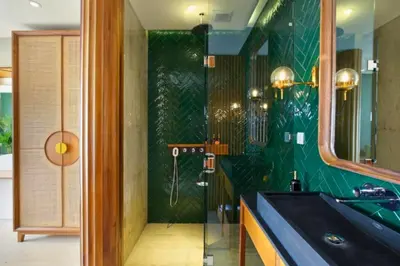 a green bathroom with a sink and a mirror at Romantic 1BR Private Pool Villa in Kerobokan