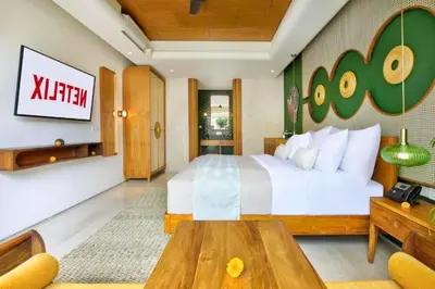 a hotel room with a bed and a table at Romantic 1BR Private Pool Villa in Kerobokan