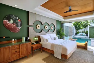a bedroom with a large bed and a pool at Romantic 1BR Private Pool Villa in Kerobokan
