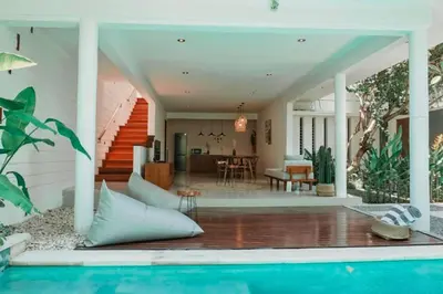 a home with a swimming pool and a house at Spacious 2 BR Private Pool Villa ZN108 in Seminyak
