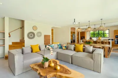 a living room with two couches and a table at Garbera 2 BR Private Pool Villa in Canggu