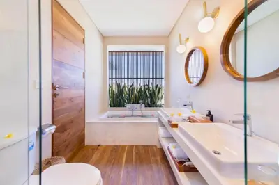 a bathroom with a tub and a sink at Garbera 2 BR Private Pool Villa in Canggu
