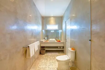 a bathroom with a white toilet and a sink at Cosy 1 Bd Pvt Apartment with shared kitchen and pool in Seminyak