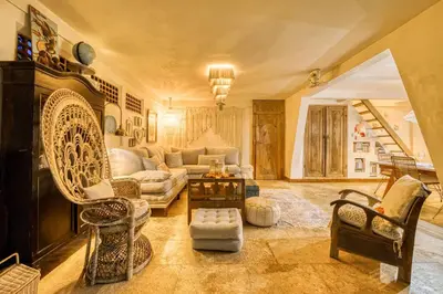 a living room with a couch and a table at New Listing 1 BD Vintage Charm in Central Berawa in Canggu