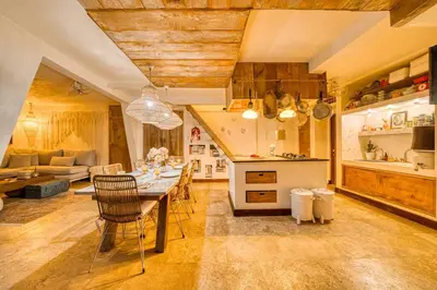 a kitchen and dining room with a table and chairs at New Listing 1 BD Vintage Charm in Central Berawa in Canggu