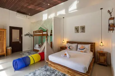 a bedroom with a large bed with a colorful mattress at Comfy 3bd Family Villa with Private Pool in Central Location in Kerobokan