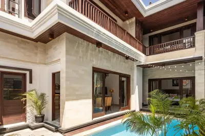 an exterior view of a house with a swimming pool at Comfy 3bd Family Villa with Private Pool in Central Location in Kerobokan