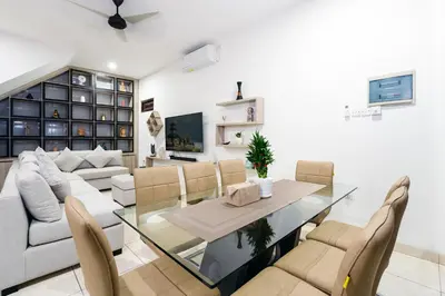 a living room with a glass table and chairs at Villa Crystal 9b in Seminyak