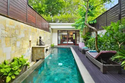 a swimming pool in the middle of a house at Dean 2 BR Private Pool Villa in Jimbaran