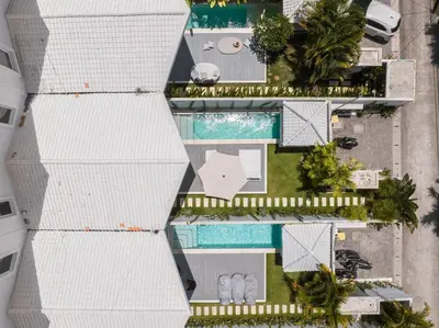 an overhead view of a building with a swimming pool at Sea Breeze Retreat Modern 3BR Villas in Canggu in Canggu