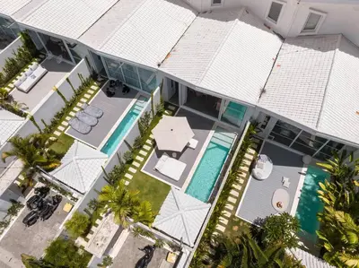 an aerial view of a house with a swimming pool at Sea Breeze Retreat Modern 3BR Villas in Canggu in Canggu