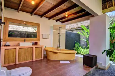 a bathroom with a bath tub and a sink at Cozy Executive 2 BR Pool Villa in Seminyak