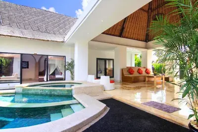 a villa with a swimming pool in a living room at Cozy Executive 2 BR Pool Villa in Seminyak