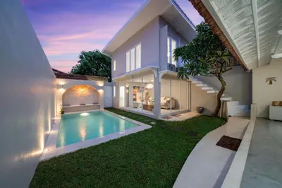 a house with a swimming pool in the yard at Lovely 3 BR villa with private pool in Canggu