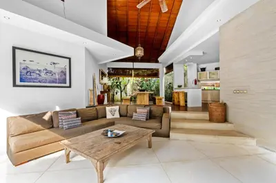 a living room with a couch and a table at Sahaja Villa by Betterplace in Canggu