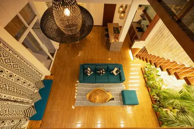 an overhead view of a living room with a table and chairs at Villa Karibu Canggu-2BR with pool & rooftop in Canggu