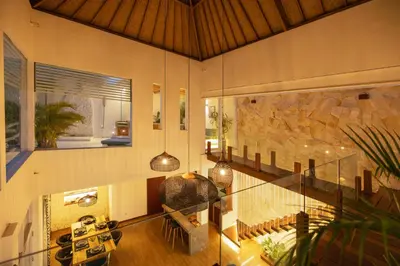 a room with a glass ceiling and a stone wall at Villa Karibu Canggu-2BR with pool & rooftop in Canggu