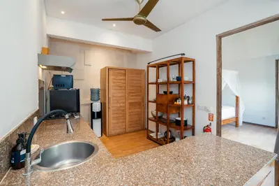 a kitchen with a sink and a counter top at Villa Casa Coral at Umalas in Kerobokan