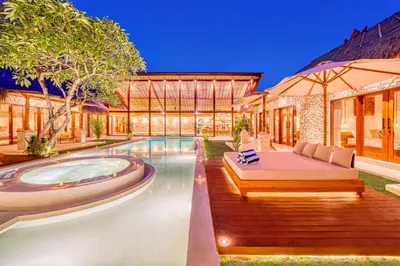 an exterior view of a house with a swimming pool at Villa Vienna - New 8BDR Jacuzzi Sauna and Cinema in Seminyak