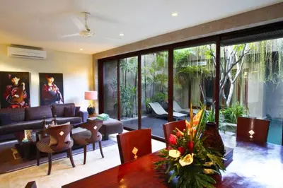 a living room with a couch and a table at Amani Entire 2 BR Private Pool Villa in Seminyak