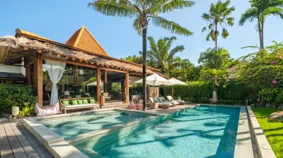 an outdoor pool at a villa with a resort at Desa Roro Estate by Villa Finder in Canggu