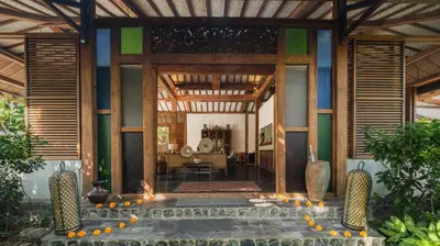 a living room with a pool in a house at Desa Roro Estate by Villa Finder in Canggu