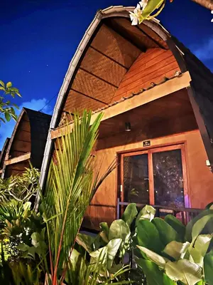 a tree house with a gambrel roof at Yogasari Villa Seminyak in Seminyak